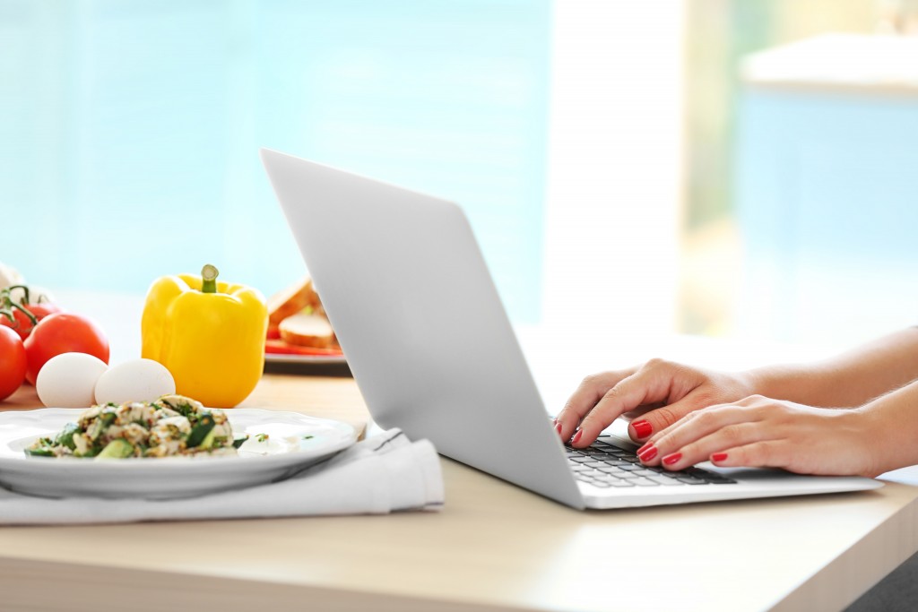 person typing on a laptop