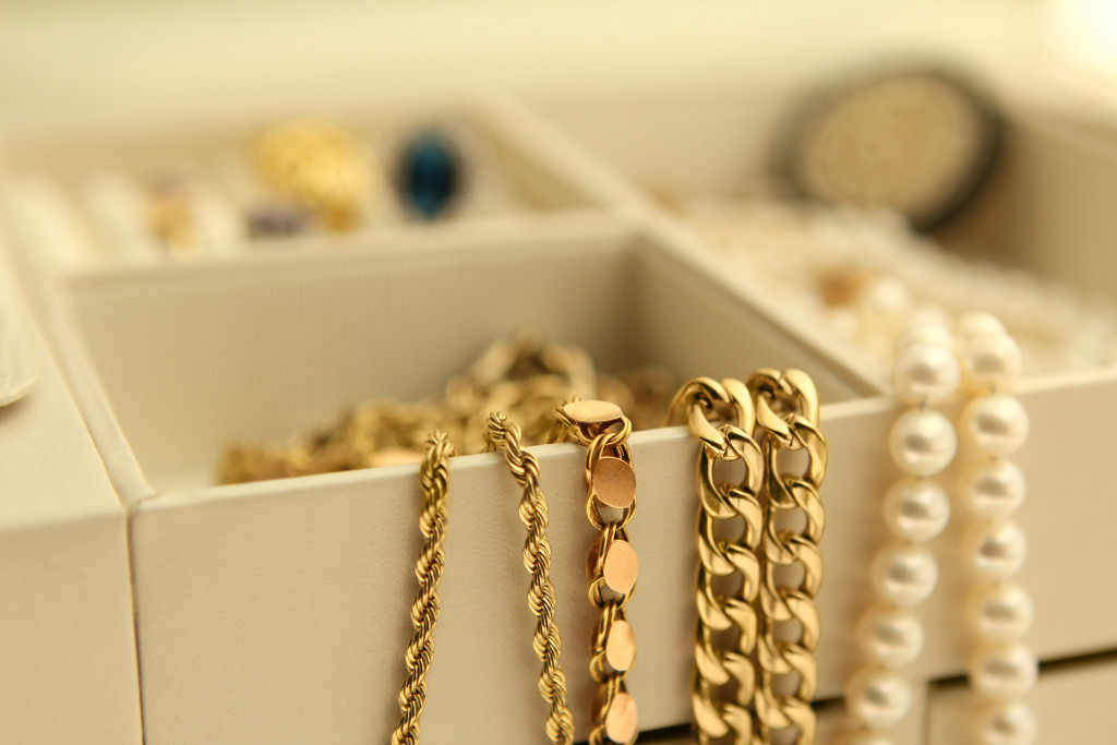 Gold jewelry and pearls in a box